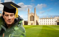 bear grylls wearing mortarboard in front of university