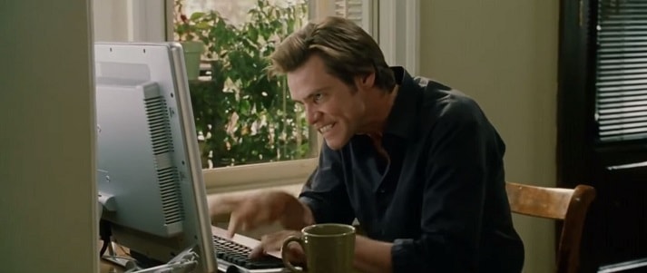 Jim Carrey as Bruce Almighty typing fast