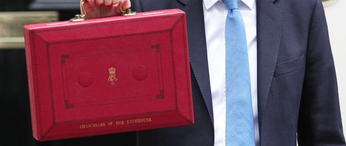 chancellor holding red briefcase