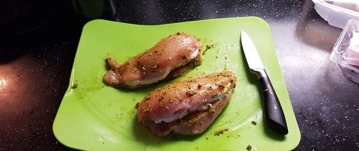 raw chicken on a chopping board