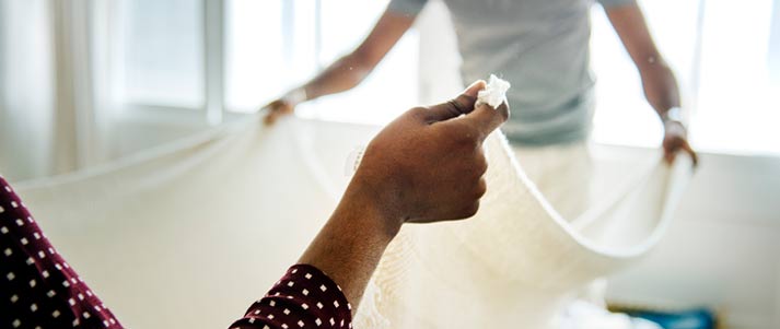 couple changing sheets