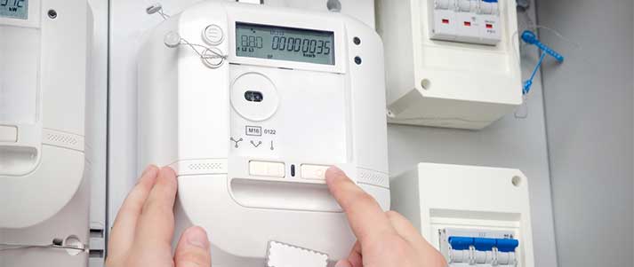 person taking reading of electricity meter