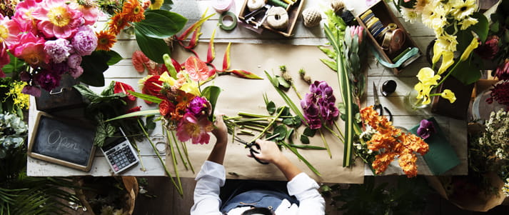 person arranging flowers