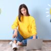 Woman at laptop with lightbulbs