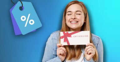 Woman holding gift card with discount sign