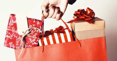 hand holding bag of presents