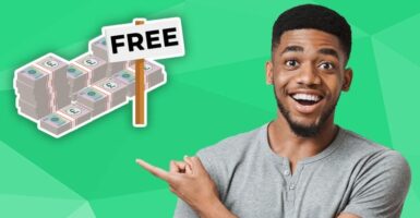 happy man pointing at pile of free money