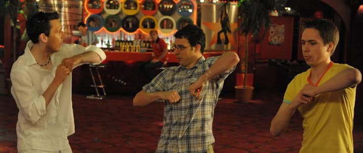 Inbetweeners on holiday dancing in a club