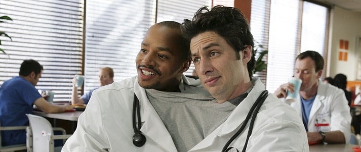 Scrubs characters sharing a lab coat