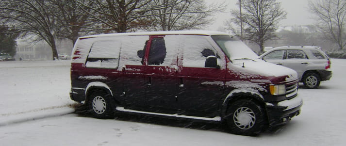 van covered in snow