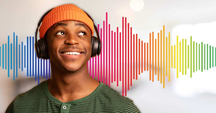 man using headphones in front of colourful soundwave