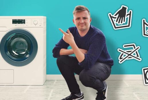 man next to washing machine and washing symbols