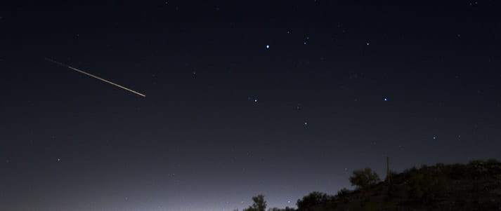 shooting star meteor in night sky