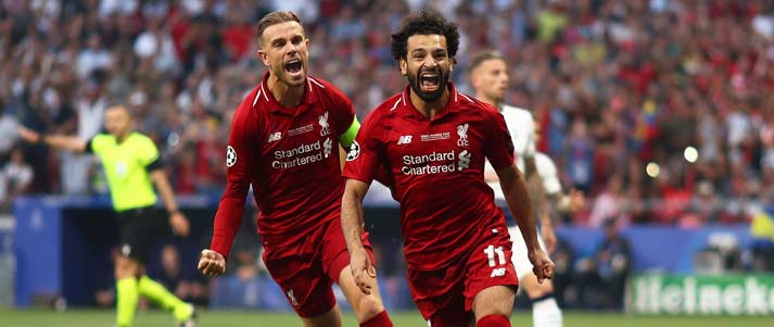 mo salah and jordan henderson celebrating a goal