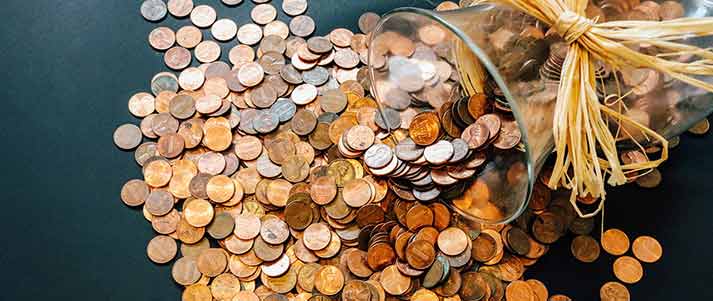 pennies spilling out of jar