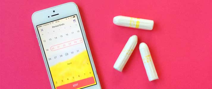 period tracker on phone with tampons