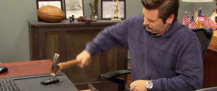 ron swanson smashing phone with hammer