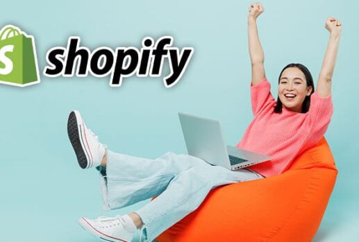Woman using a laptop with Shopify logo