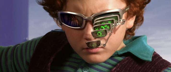 spy kid wearing magnifying glasses