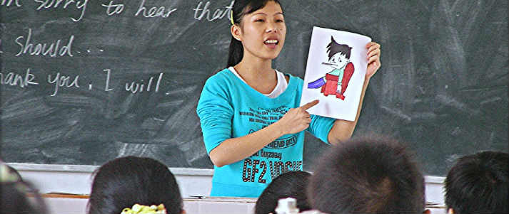 Girl showing class her drawing
