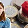 woman thinking next to house on money