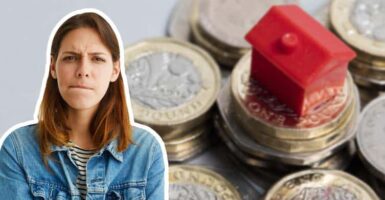 woman thinking next to house on money