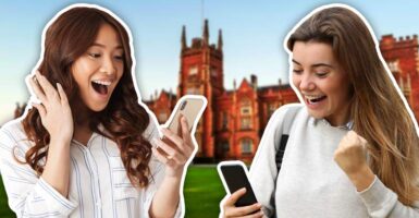 two excited happy students looking at their phones