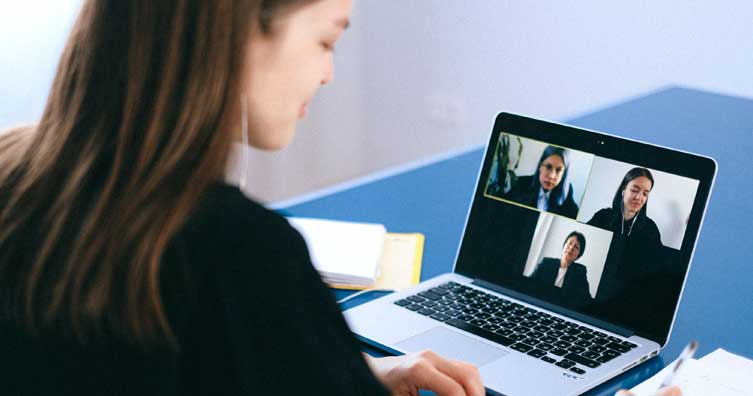 Woman on computer interview for work