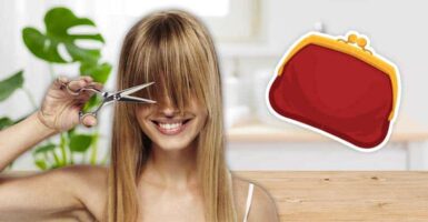 woman cutting her hair in bathroom next to purse