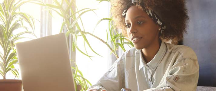 woman typing on laptop