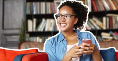 woman smiling on phone