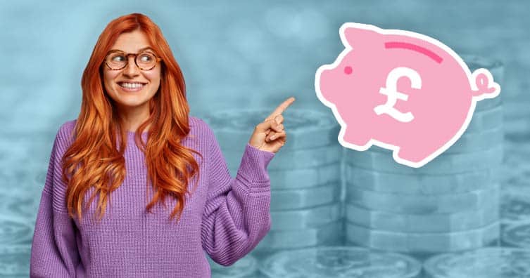 woman pointing at piggy bank in front of pound coins