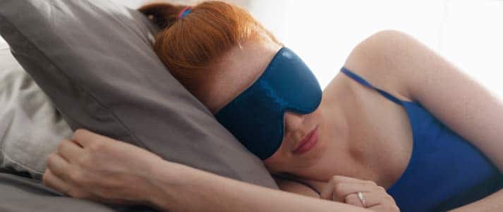 woman sleeping in eye mask
