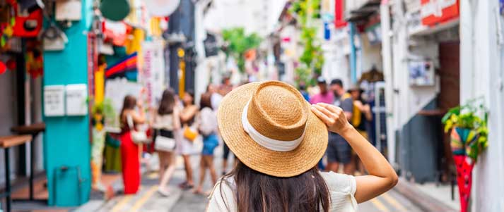 Young woman walking through the streets of Singapore