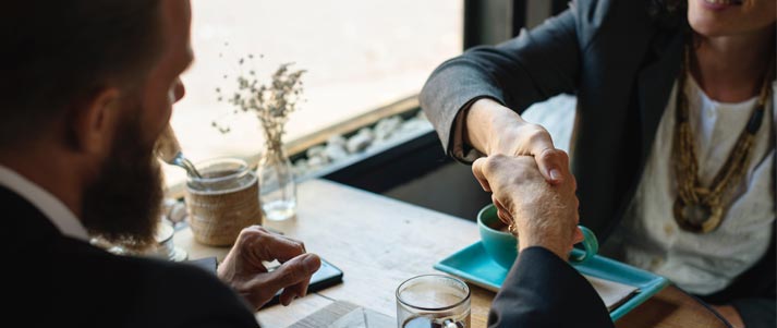 man and woman with professional handshake