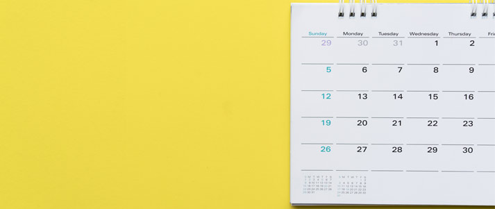 calendar in front of a yellow background