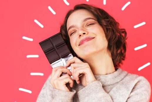happy woman with a bar of chocolate