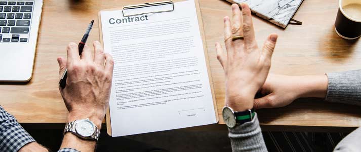 people signing contract