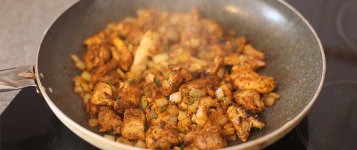 frying pan with chicken and veg