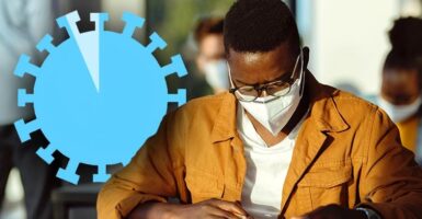 man with mask studying with coronavirus symbol