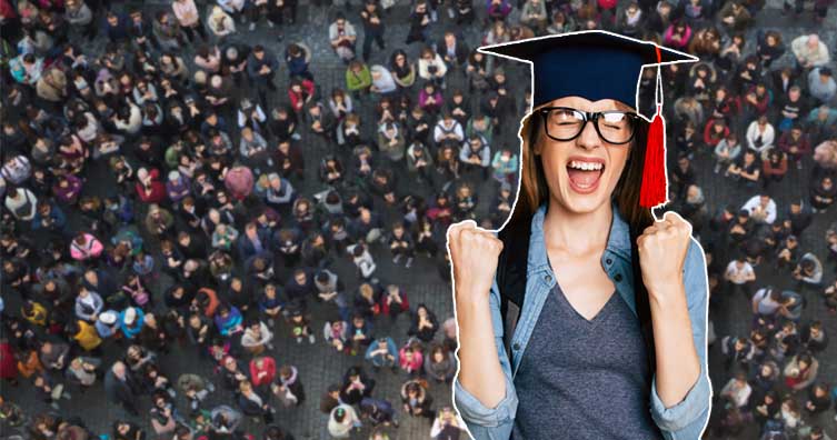 woman in graduation cap cheering