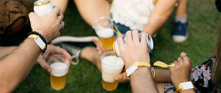 people sharing beer at a festival