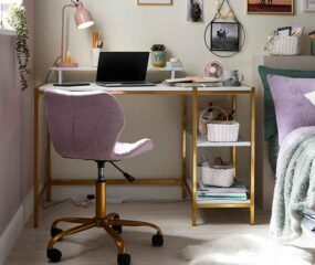 student bedroom with desk and chair next to bed