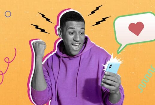 A young man looking excited as he looks at his phone