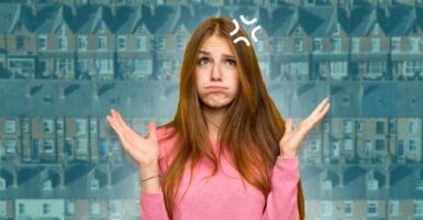 frustrated woman in front of terrace houses