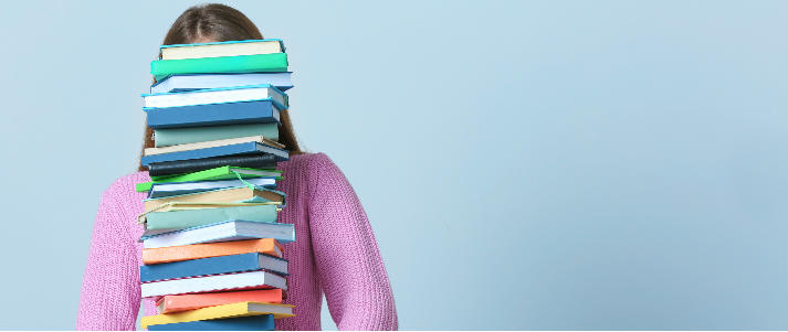 woman carrying textbooks