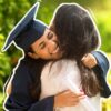 Graduate hugging mother