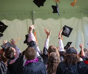graduate students throwing hats