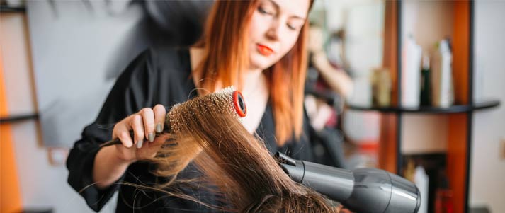 hairdresser blow dry at hair salon