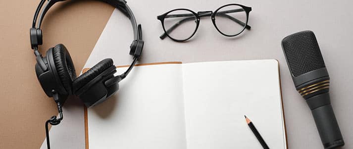 headphones, notebook, glasses and microphone